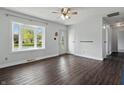 Bright living room featuring hardwood floors, a ceiling fan, and a bay window at 250 3 Notch Ln, Bargersville, IN 46106