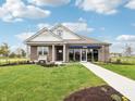 Attractive home with landscaped front yard and clear blue sky above at 30 Benfield Dr, Whiteland, IN 46184