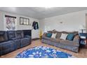 Cozy living room with comfortable seating, area rug and plenty of natural light at 303 W 7Th St, Lapel, IN 46051