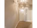 Bright entryway with wood floors, a classic white door, and neutral walls creating a welcoming ambiance at 5845 Arrowleaf Ln, Carmel, IN 46033