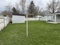Large backyard with green grass, a storage shed, and ample space at 823 N Noble St, Greenfield, IN 46140