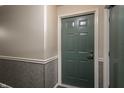 A solid, neutral-colored door with classic hardware, adding a sense of security and style at 8911 Hunters Creek Dr # 311, Indianapolis, IN 46227