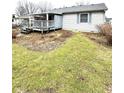 Backyard view of a home featuring a deck overlooking the lawn and surrounding homes at 952 Delray Dr, Indianapolis, IN 46241
