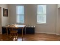 Bright dining area with hardwood floors and a window seat, perfect for casual meals and gatherings at 1041 Hervey St, Indianapolis, IN 46203