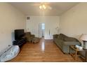 Open living room with hardwood floors, neutral paint, and ample space for relaxing and entertaining at 1041 Hervey St, Indianapolis, IN 46203