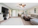 Inviting living area with a cozy fireplace feature, and comfortable sectional sofa at 132 Thistlewood Dr, Greenfield, IN 46140