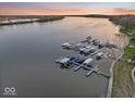 An aerial view of community boat docks on the water, providing convenient access for residents, perfect for lake living at 13797 E Southshore Dr, Fishers, IN 46037