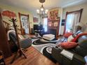 Spacious living room with fireplace, elegant furnishings, and ample natural light at 23 N West St, Shelbyville, IN 46176