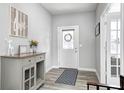 Inviting foyer with stylish flooring, neutral walls, and modern décor at 2428 S Stonehill Way, New Palestine, IN 46163