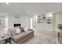 Comfortable living room with hardwood floors, fireplace, and built-in shelving at 360 Hope Ct, Greenwood, IN 46142