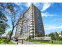 Striking high-rise building with balconies, beautiful blue skies and green grounds at 4000 N Meridian St # 9E, Indianapolis, IN 46208