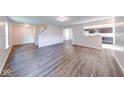 Spacious living room with hardwood floors and an open floor plan with views to the kitchen at 4046 Denali Dr, Indianapolis, IN 46235