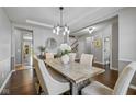 Elegant dining room with stylish lighting and comfortable seating for dinner parties at 5635 Pennycress Dr, Noblesville, IN 46062