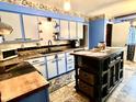 Bright kitchen featuring unique cabinets, modern appliances, and a functional center island at 5817 Oliver Ave, Indianapolis, IN 46241