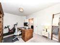 Versatile office features desk, ladder and stationary bike at 6040 Juniper Ct, Whitestown, IN 46075