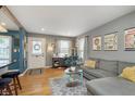 Inviting living room with hardwood floors, stylish decor, and an abundance of natural light at 6180 Crittenden Ave, Indianapolis, IN 46220