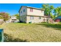 Spacious backyard with plenty of green space and a deck, perfect for outdoor activities and relaxation at 7108 Hearthstone Way, Indianapolis, IN 46227