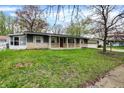 Charming one-story home featuring a well-maintained lawn and a classic ranch-style facade at 7212 E Pleasant Run Pkwy S Dr, Indianapolis, IN 46219