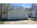 Spacious two-car garage with concrete driveway offers convenient parking and storage space at 8200 E Desoto St, Muncie, IN 47303