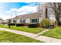 Traditional home with well-maintained landscaping, featuring a green lawn and classic lamp post at 830 N 16Th St, Elwood, IN 46036