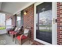 Inviting front porch with cozy seating, perfect for relaxing and enjoying the outdoors at 10883 Balfour Dr, Noblesville, IN 46060