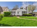 Charming single-Gathering home with tidy landscaping and a walkway leading to the front door at 1327 Lindberg Rd, Anderson, IN 46012