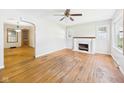Bright living room featuring hardwood floors, a fireplace, and an abundance of natural light at 1327 Lindberg Rd, Anderson, IN 46012
