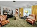 Cozy living room featuring plush chairs, soft lighting, and a classic decorative aesthetic at 1331 Dunlap Ave, Indianapolis, IN 46241
