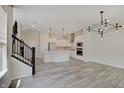 Open concept living space with a staircase and an open kitchen area at 13392 Dorster St, Fishers, IN 46037