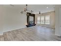 Spacious living room features a modern fireplace and stylish lighting at 13392 Dorster St, Fishers, IN 46037