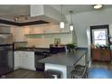 Well-lit kitchen with white cabinetry, stainless steel appliances, and a functional island, perfect for culinary enthusiasts at 1404 Broadway St # Apt G, Indianapolis, IN 46202