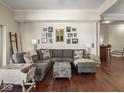 Spacious living room with hardwood floors, comfortable seating, and stylish decor, creating an inviting atmosphere at 1429 Fletcher Ave, Indianapolis, IN 46203