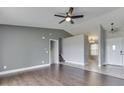 Living room boasts hardwood floors and ceiling fan at 212 Westridge Blvd, Greenwood, IN 46142