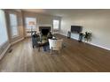 Bright living room with wood floors, a decorative fireplace, and modern furnishings at 2135 Union St, Columbus, IN 47201
