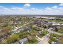 A residential neighborhood showcases single-Gathering homes with mature trees and a clear view of the horizon at 2219 N Webster Ave, Indianapolis, IN 46219