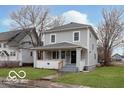 Charming two-story home with a covered front porch and freshly painted siding at 3758 Broadway St, Indianapolis, IN 46205