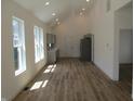 Modern, open kitchen with stainless steel appliances, beautiful wood floors and recessed lighting at 4234 Kingsley Dr, Indianapolis, IN 46205