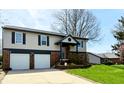 Beautiful two-story home with a two-car garage and well manicured lawn at 436 Tavistock Dr, Mooresville, IN 46158