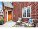 Cozy porch seating area with comfortable chairs, perfect for relaxing outdoors at 5611 N Delaware St, Indianapolis, IN 46220