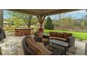 Relaxing backyard patio with a hot tub and outdoor seating for entertaining at 5895 Sugar Pine Dr, Avon, IN 46123