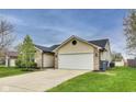 Charming single-story home featuring brick and vinyl siding, attached garage, and well-maintained lawn at 6218 Churchman Way, Indianapolis, IN 46237
