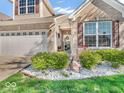 Lovely front yard with white rock garden bed and a welcoming entrance at 6502 E Walton Dr, Camby, IN 46113