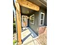 Inviting entryway showcasing a decorative glass door, new wood post, and brick accents at 653 Southridge Ct, Westfield, IN 46074