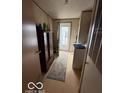 Small laundry room with washer and dryer and linoleum flooring at 7765 N 225 W, Lebanon, IN 46052
