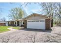 A brick house showing the two-car garage with lots of driveway space at 8051 Sycamore Springs Trl, Indianapolis, IN 46239