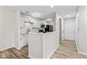 Modern kitchen featuring sleek white cabinets, stainless steel appliances, and stylish countertops at 8216 Glenwillow Ln # 104, Indianapolis, IN 46278