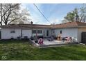 A cozy backyard patio with outdoor seating and play area at 829 Washington Ave, Cicero, IN 46034