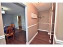 Inviting entryway with hardwood floors, neutral paint, and decorative accents creating a warm welcome at 1000 Riverview Dr, Martinsville, IN 46151