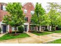 Lovely brick townhomes with well-maintained lawns and beautiful trees at 11905 Kelso Dr # 3, Zionsville, IN 46077