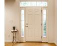 Bright foyer with white front door, sidelights, and elegant decor at 11905 Kelso Dr # 3, Zionsville, IN 46077
